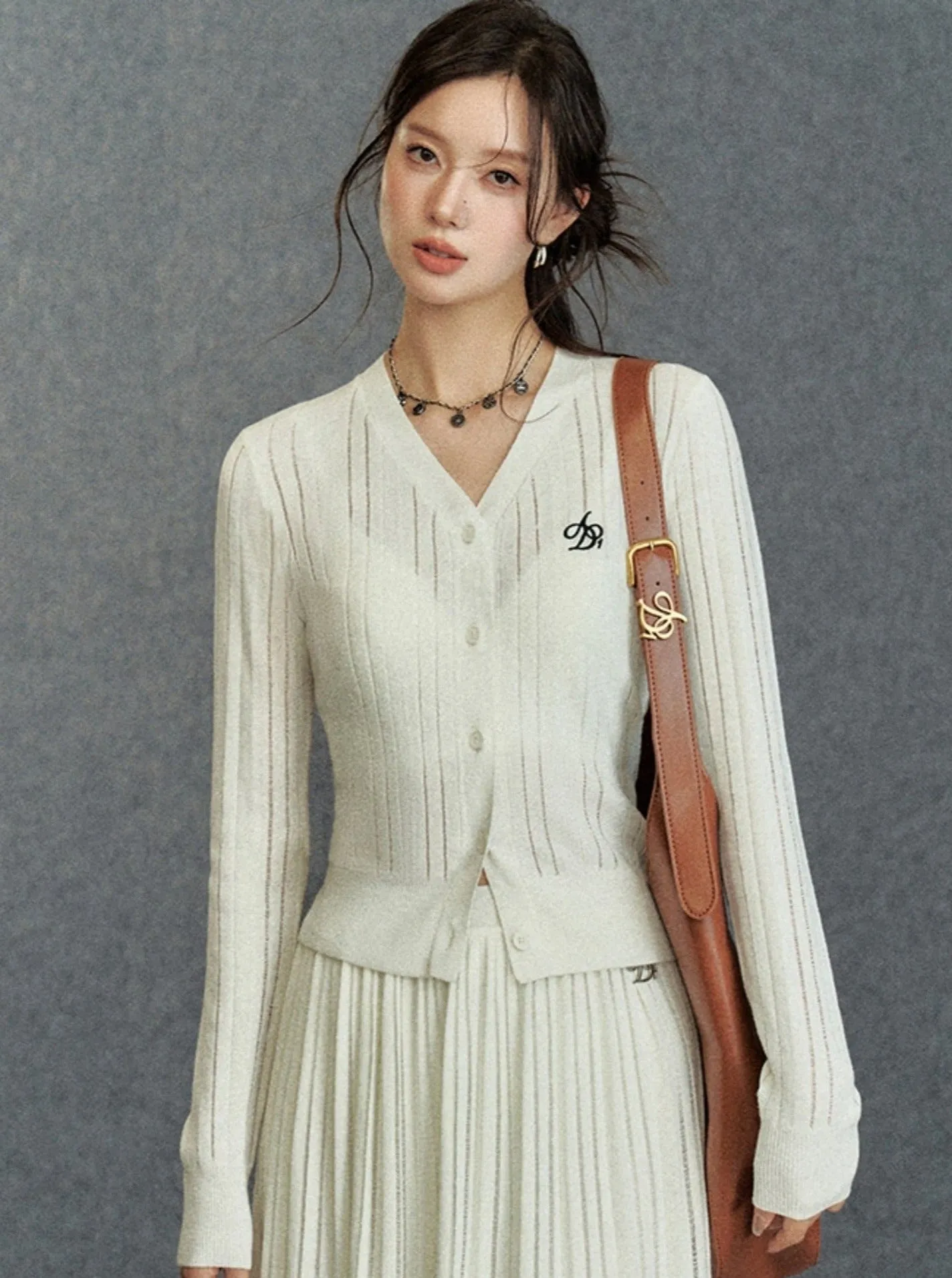 Elegant Ribbed Cardigan: Classic V-Neck with Signature Embroidery