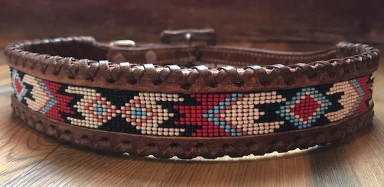 Genuine leather dog collar with red, white, and black navajo beaded inlay design, a leather wrapped edge